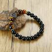 Bracelet homme en perles noires et Oeil de Tigre � croix