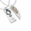 Paire de pendentifs symboles feminin masculin