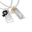 Paire de pendentifs symboles feminin masculin